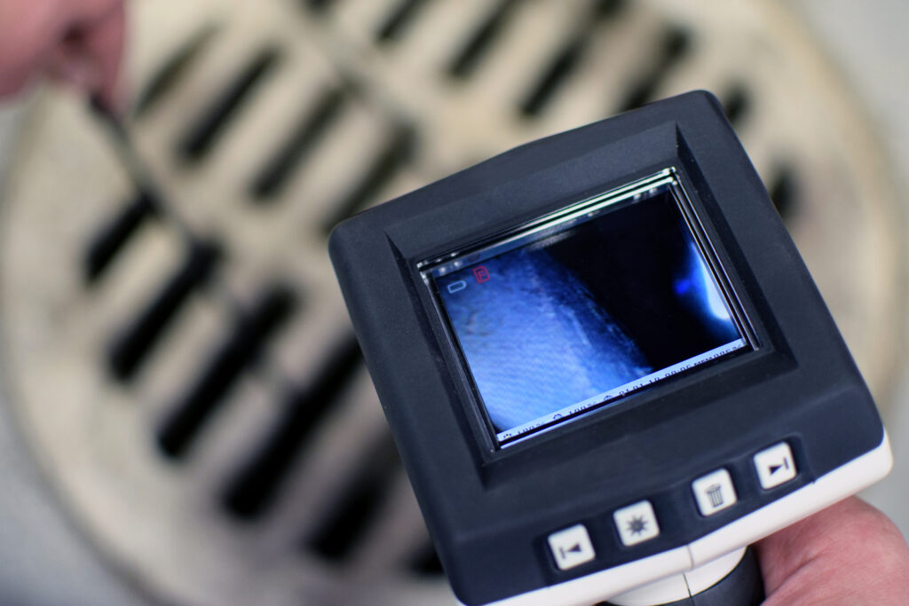 Closeup of video feed from a sewer camera inspection